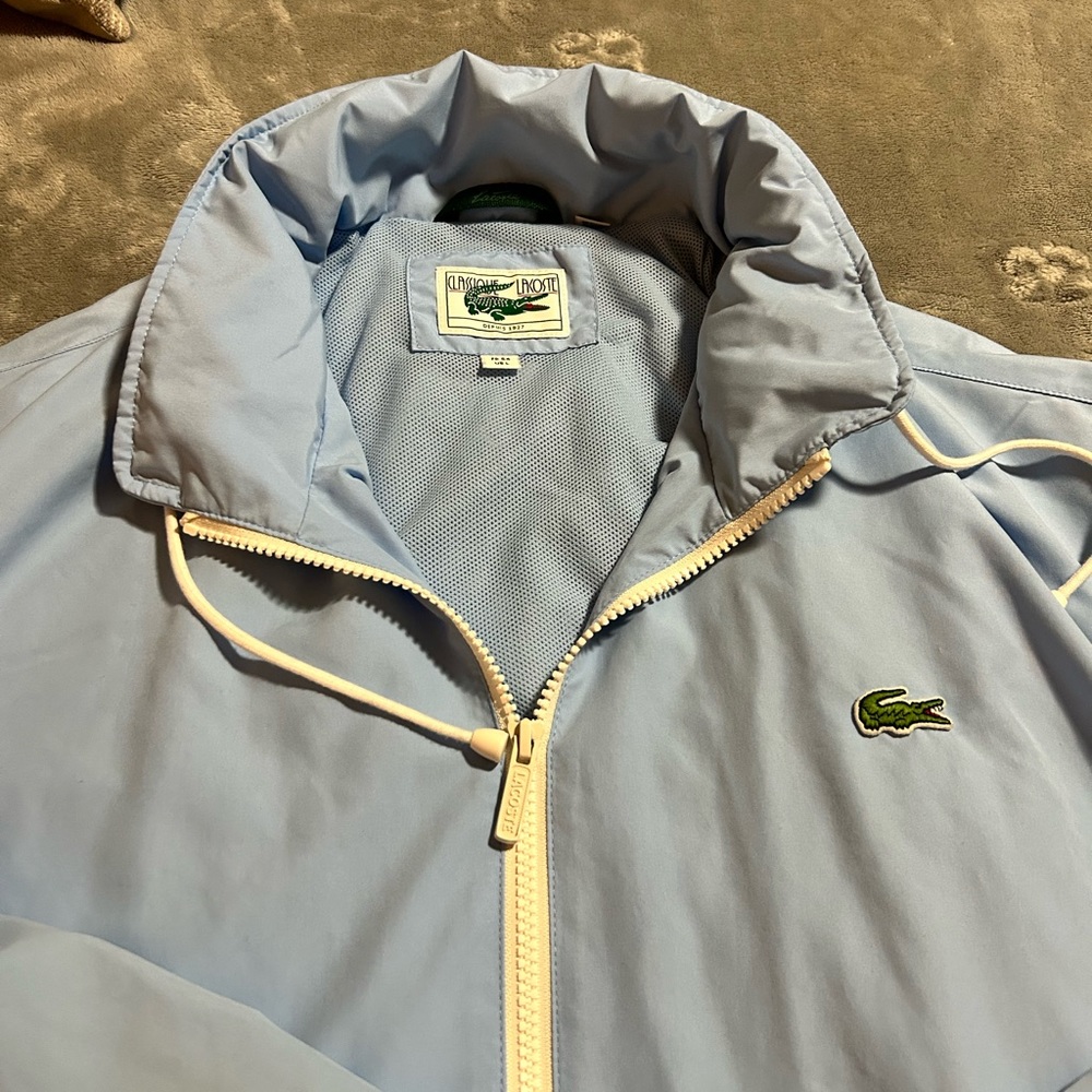Lacoste Mens large baby blue windbreaker. Hardly worn.